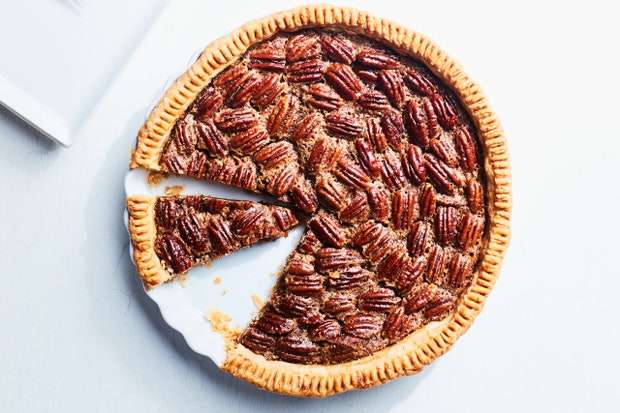 A pecan pie with a slice removed