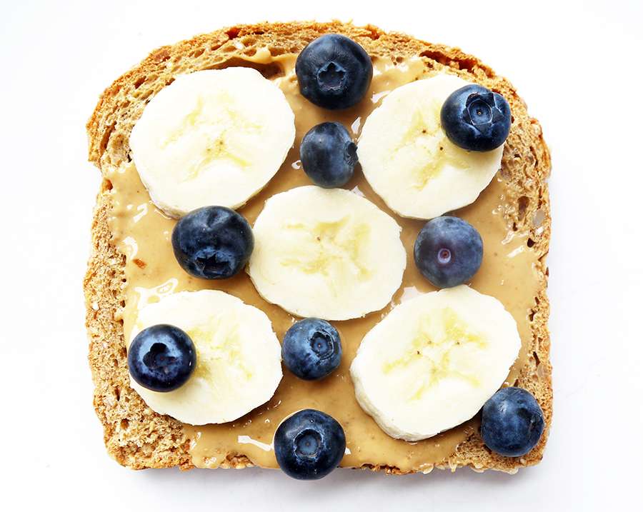 Blueberry and banana whole wheat toast with peanut butter