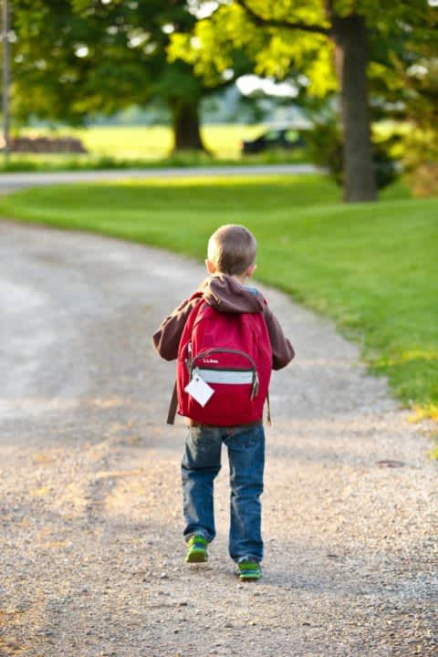 Student with a new backpack walking