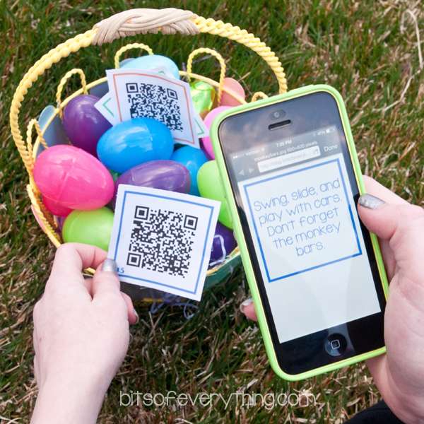 Smartphone scanning QR code that is over an Easter basket filled with colorful plastic eggs.