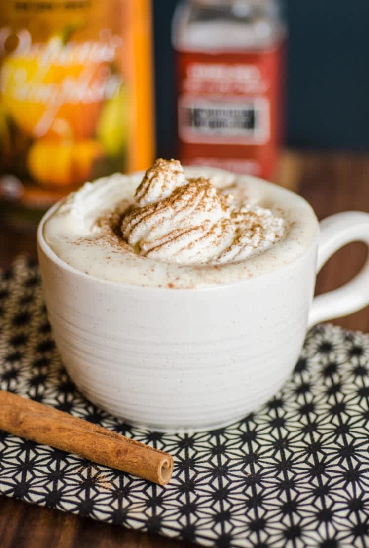 A pumpkin spice latte in a large ceramic mug