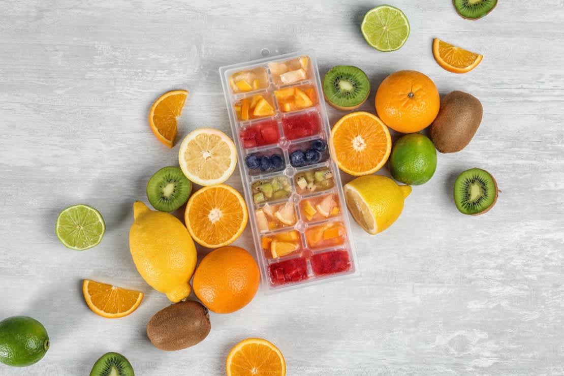 Ice cube tray and fresh fruits