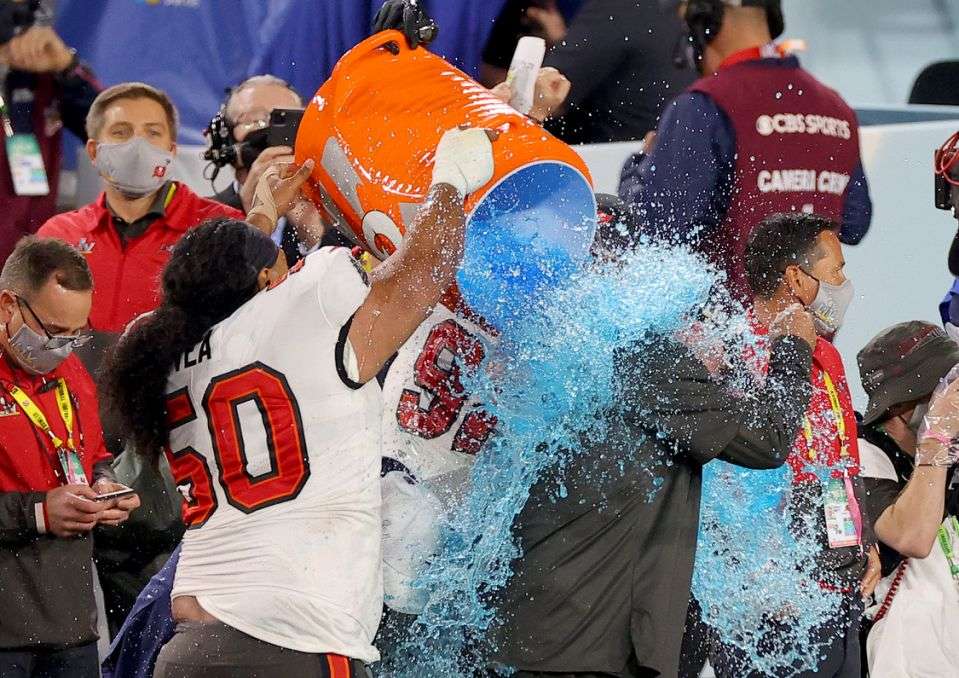 Sportsmen being splashed with gatorade