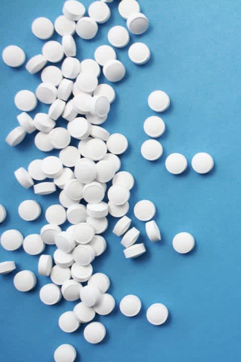  Small, white tablets of medication