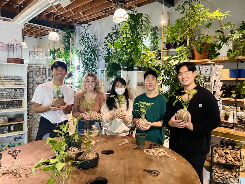 Picture from our Fall 2023 offsite where we made kokedama