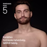 Fiatal, félmeztelen, szakállas férfi a Braun Series 5 multifunkciós trimmelőkészlet használata után Fiatal, félmeztelen, szakállas férfi a Braun Series 5 multifunkciós trimmelőkészlet használata után