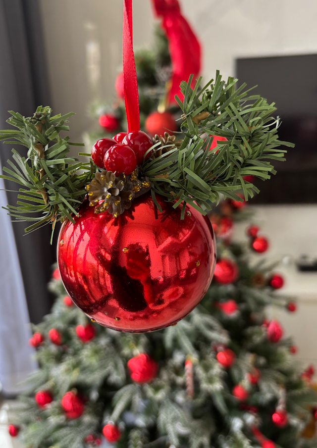 Red Christmas baubles with berry