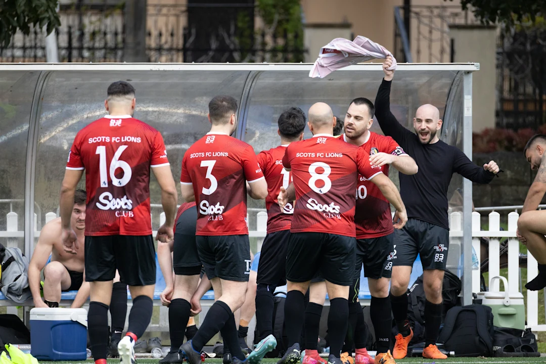 Football players celebrating a victory on the field.