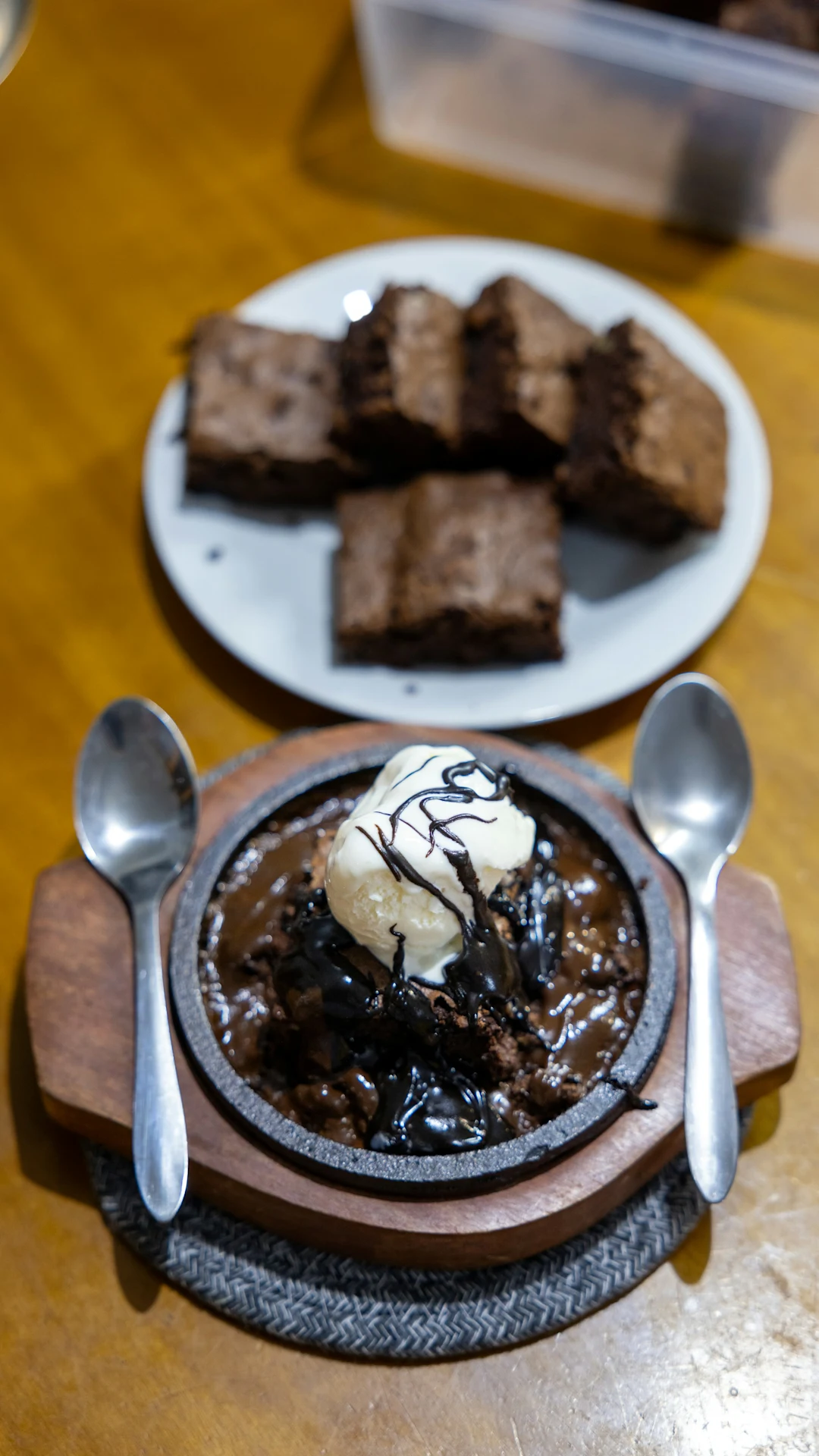 Hot chocolate brownie with ice cream and spoons