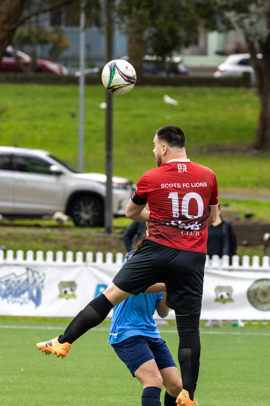 Soccer player heads ball during game