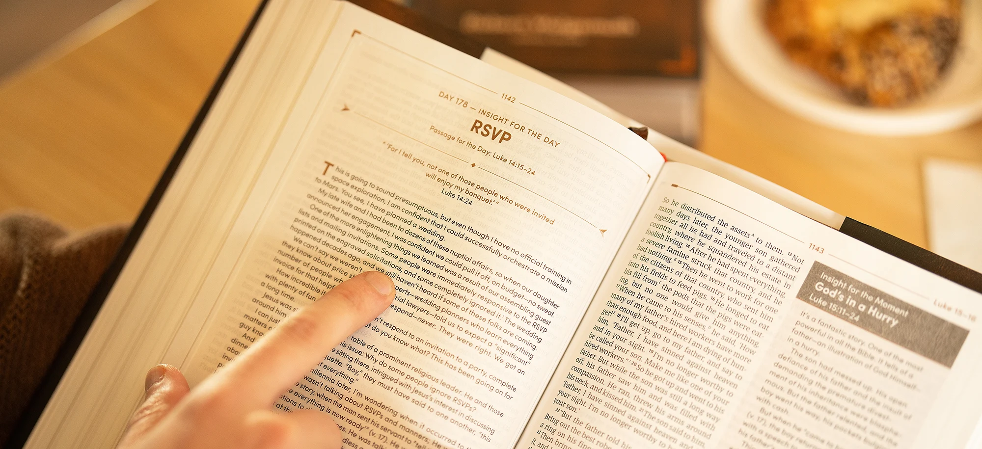 Men's Daily Bible contributors image showing pages from the Bible.