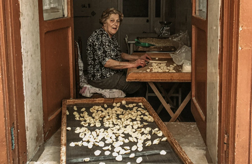 Woman making orecchiette.