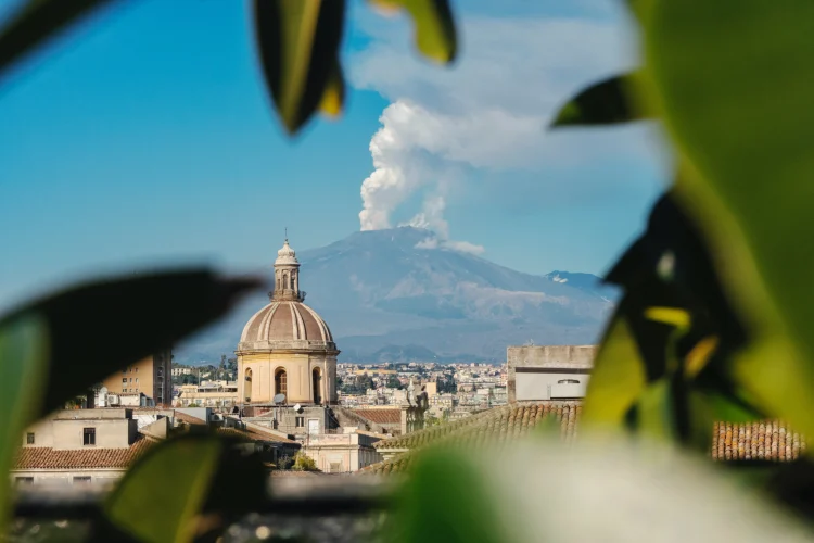 View over Catania and active volcano Mount Etna