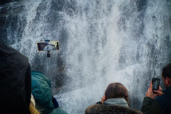 People photographing a waterfall