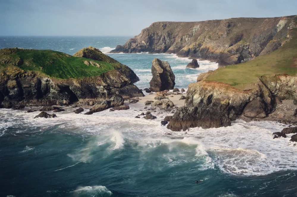 High waves crashing against steep cliffs