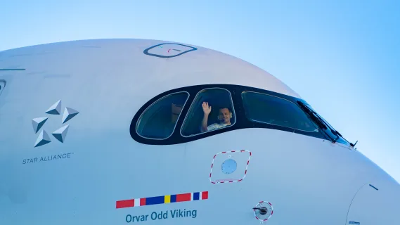 SAS pilot waving