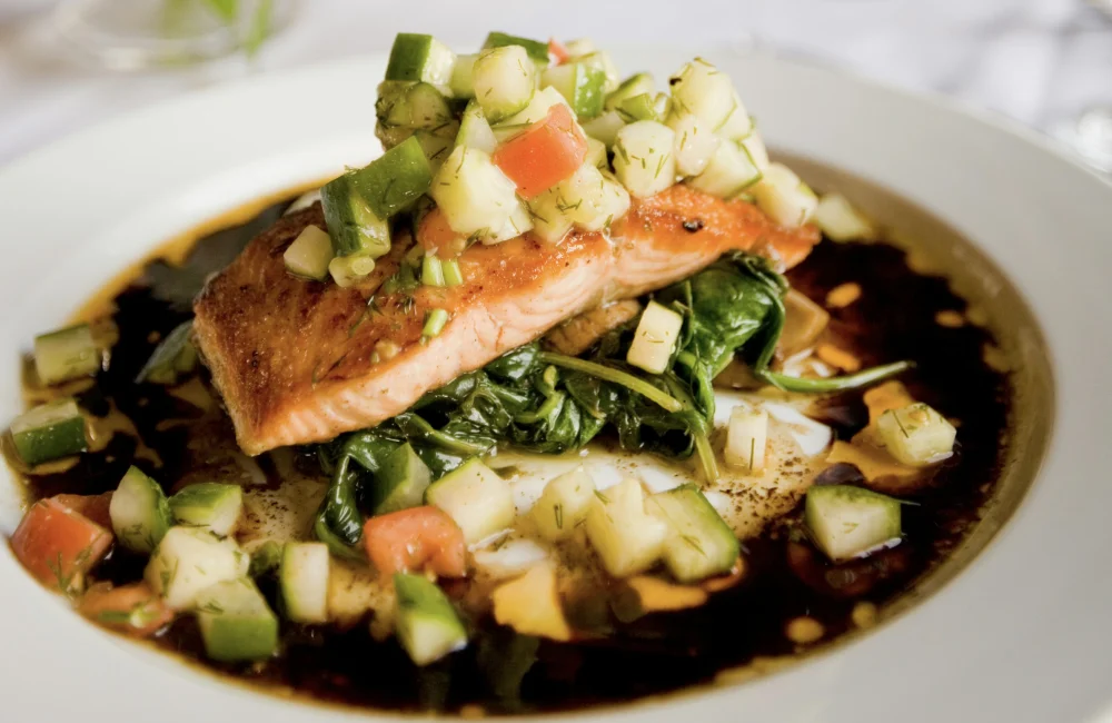 Salmon served with fresh vegetables