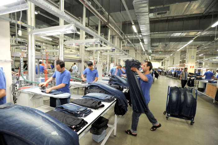 workers busy working in a jeans factory