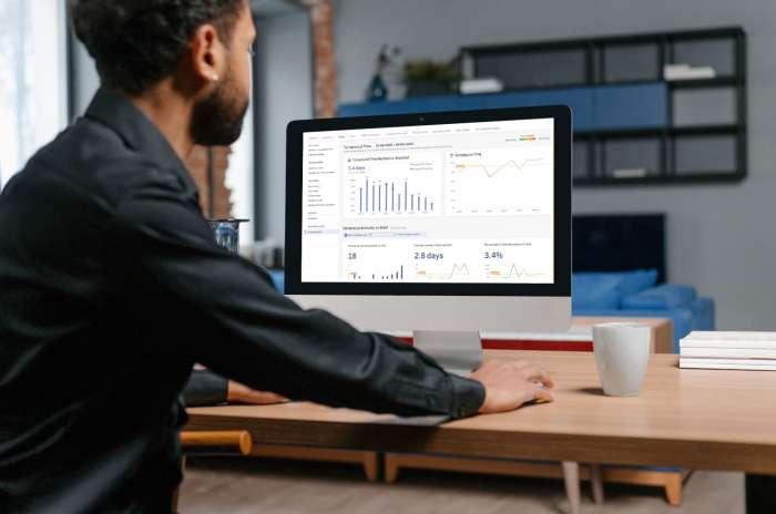 a man on computer looking at QIMA's lab testing dashboard