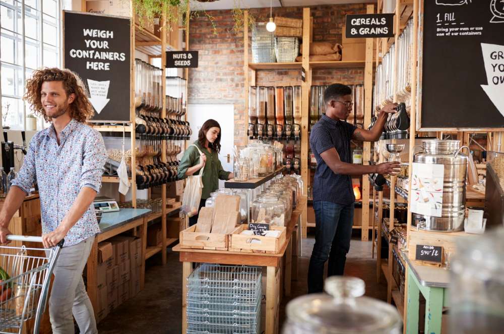 customers shopping at a sustainable self-refill grocery store