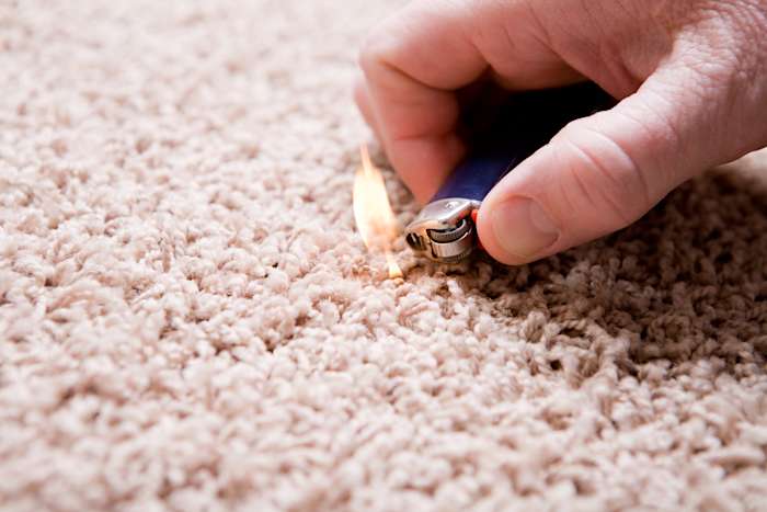 Lighter burning test on carpet