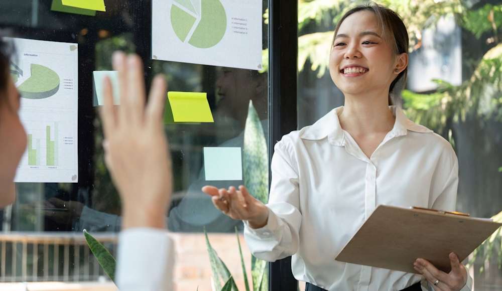 A young professional presenting sustainable solutions in a business environment 