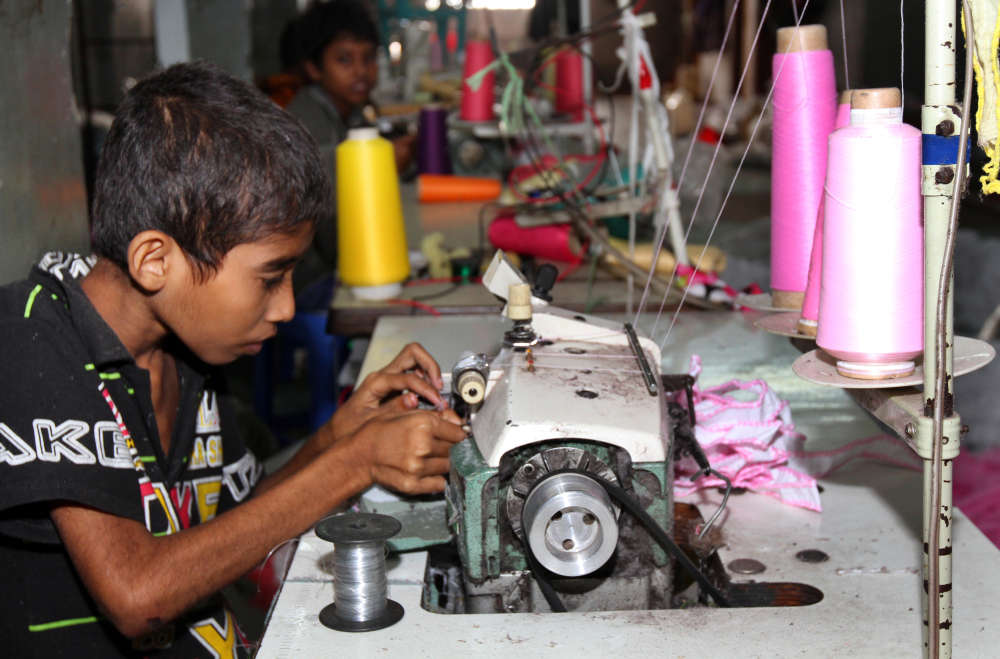 Child working in factory | QIMA - products made with forced labor