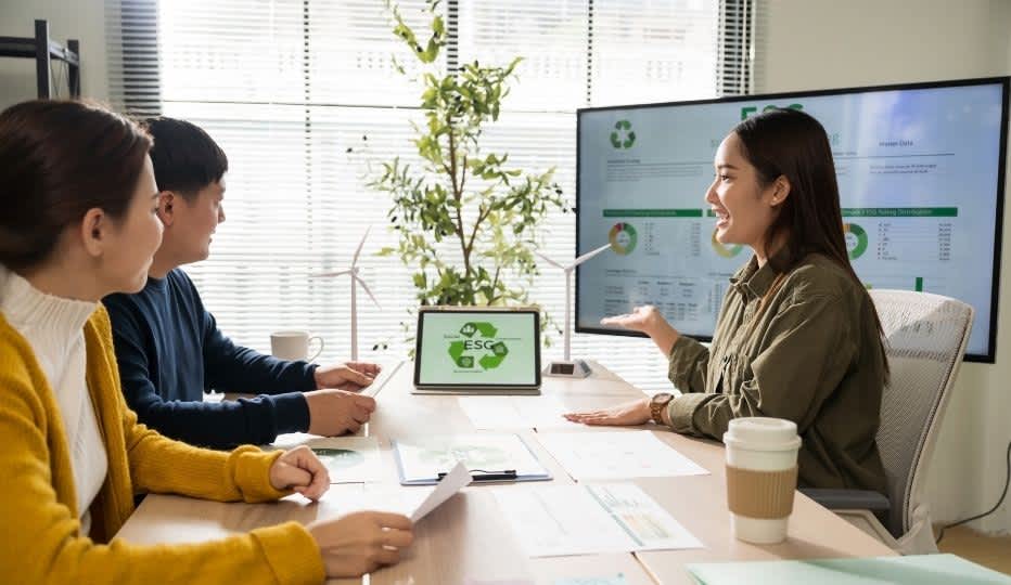 Asian business leaders meeting ESG strategize on sustainable environmental practices