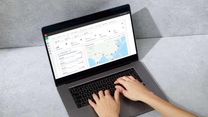 Laptop with interface displaying analytics and data, representing the technological tools used for improving supply chain visibility