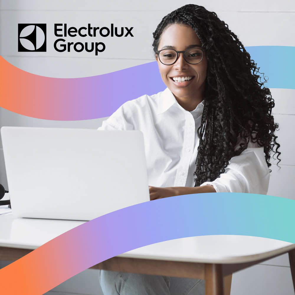 Young, female Electrolux employee working at her desk