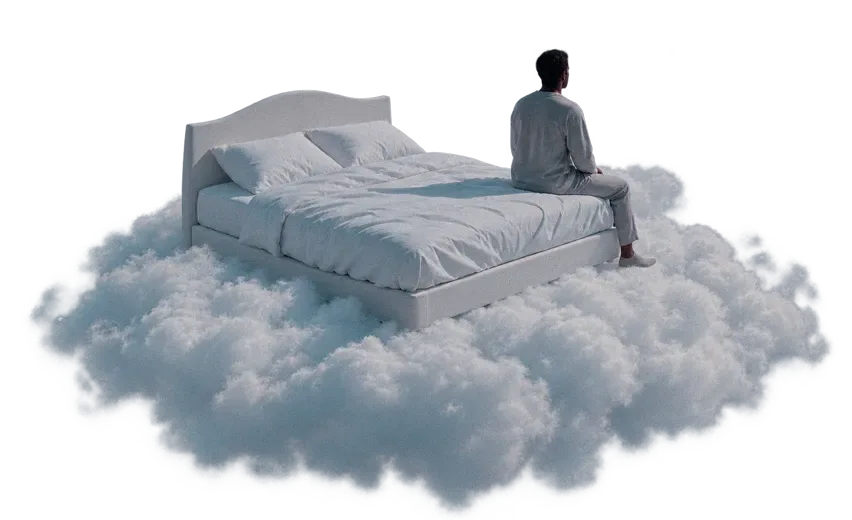 Person sitting on bed surrounded by clouds in muted blue-gray tones, creating a dreamy, surreal atmosphere.