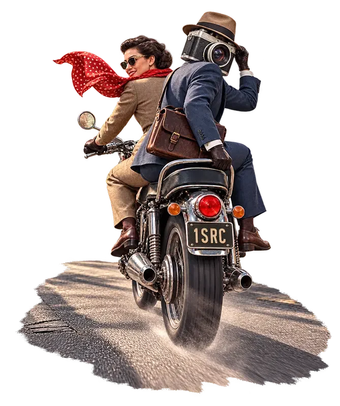 Two vintage-styled travelers riding a motorcycle, woman in tan suit with red polka dot scarf, man in blue suit with camera head.