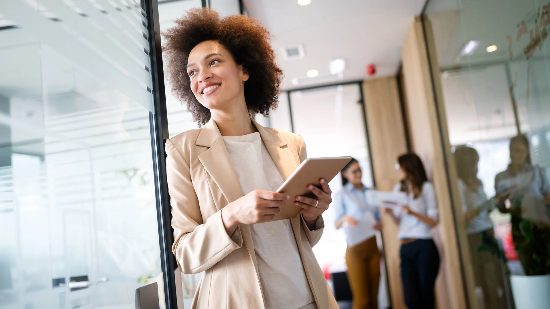 Woman on Tablet Smiling