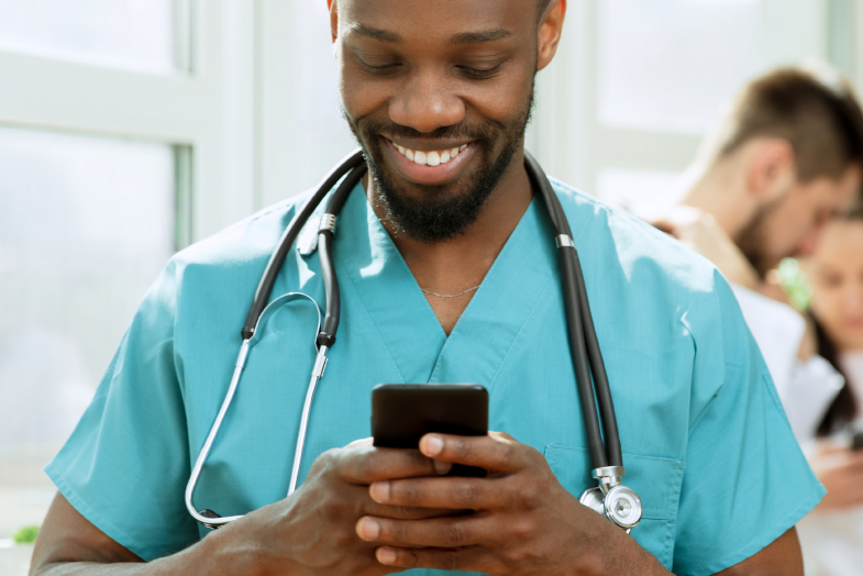 man wearing green scrubs and stethoscope 