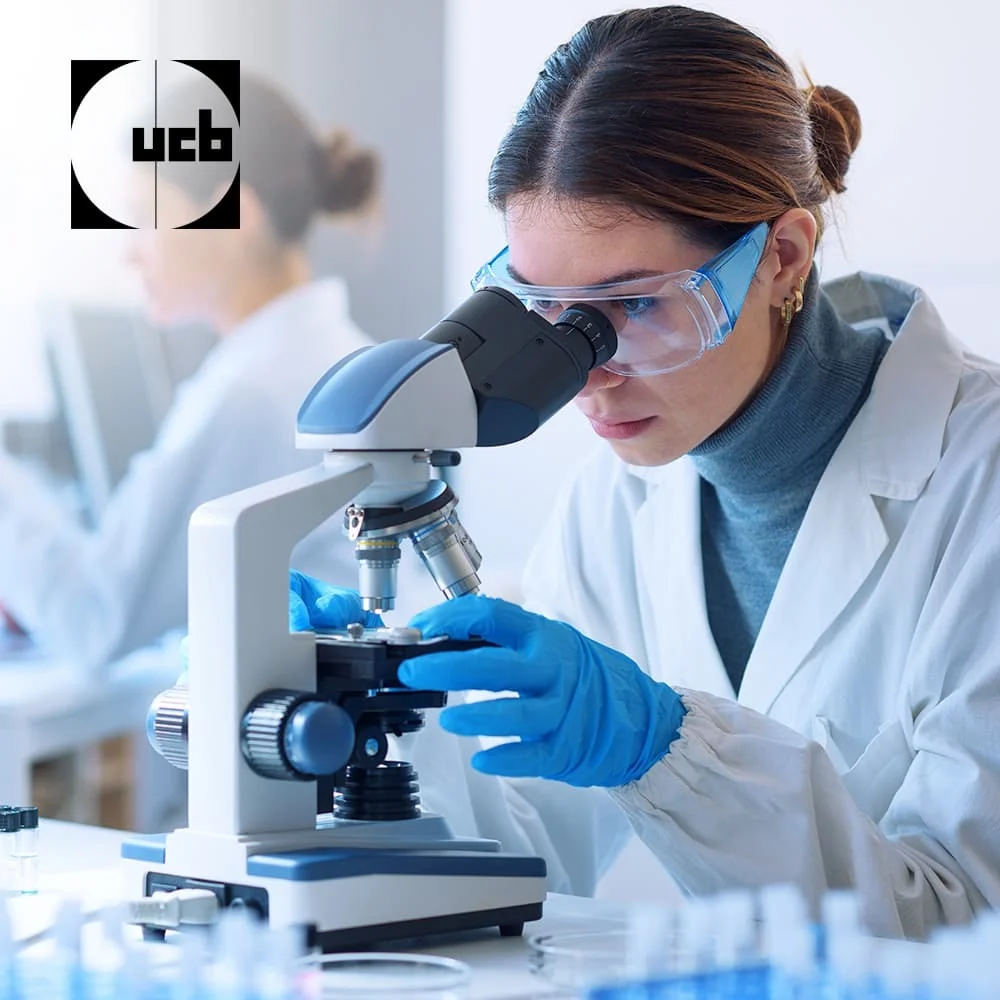 Woman looking through a microscope