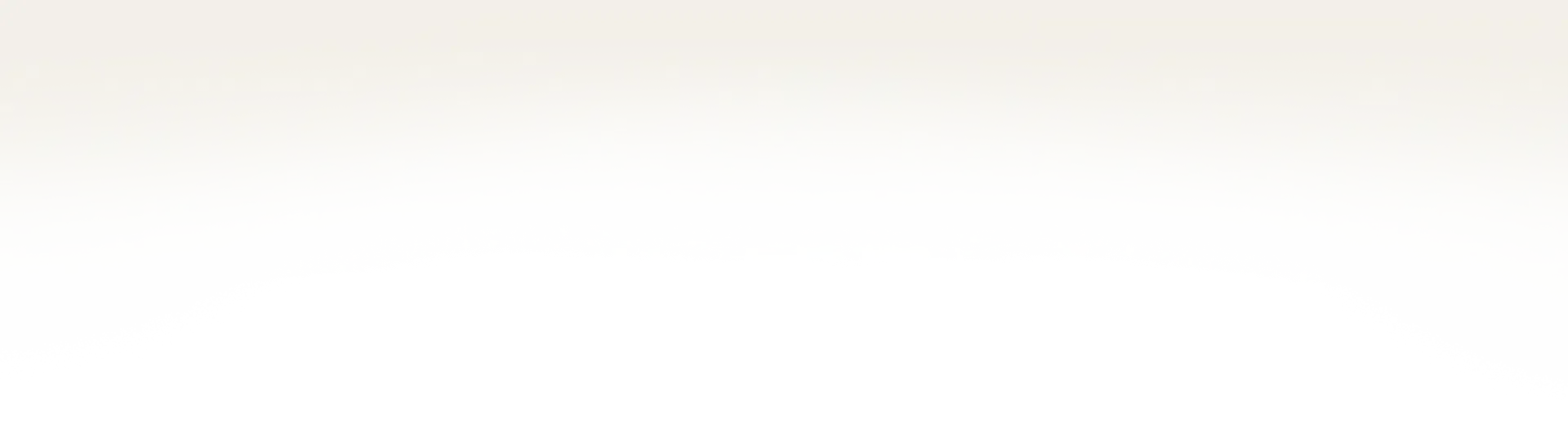 Light beige or off-white solid color background with no visible subjects, text, or design elements.
