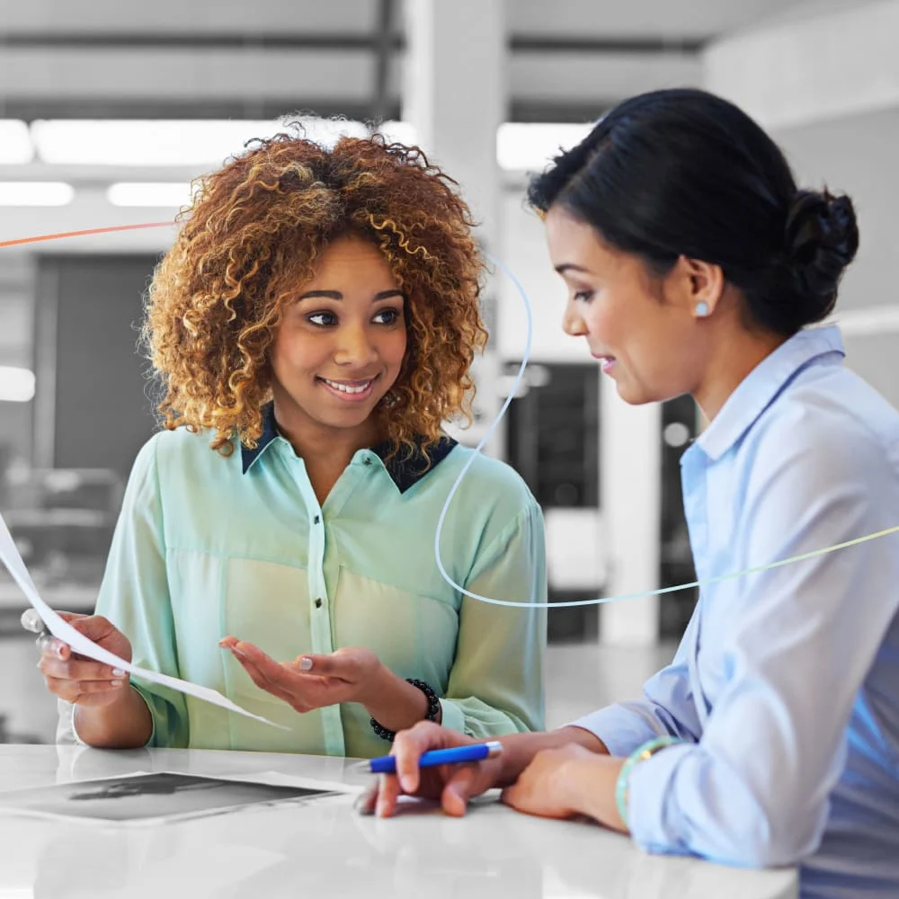 Two HR professional women collaborating