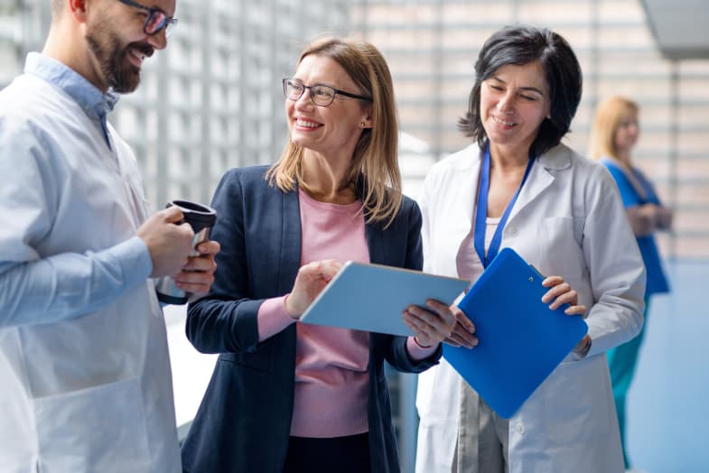 group of medical colleagues smiling standing together