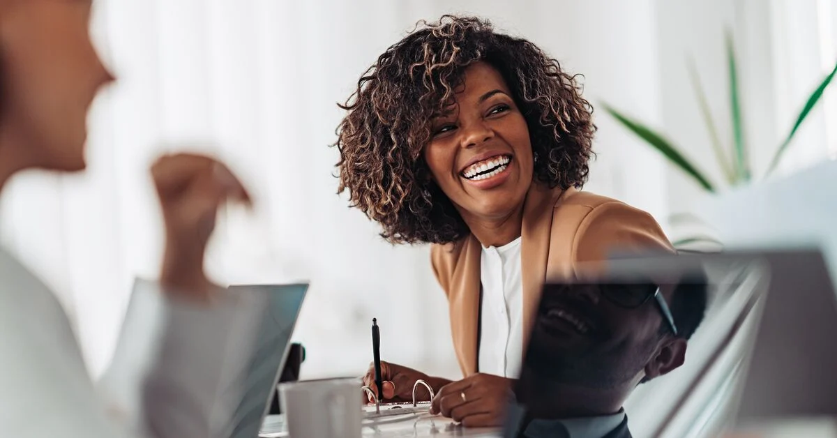 Young woman smiling during meeting