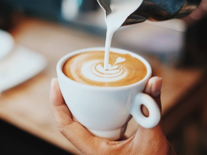 column-content-wrapper-person-making-latte-art