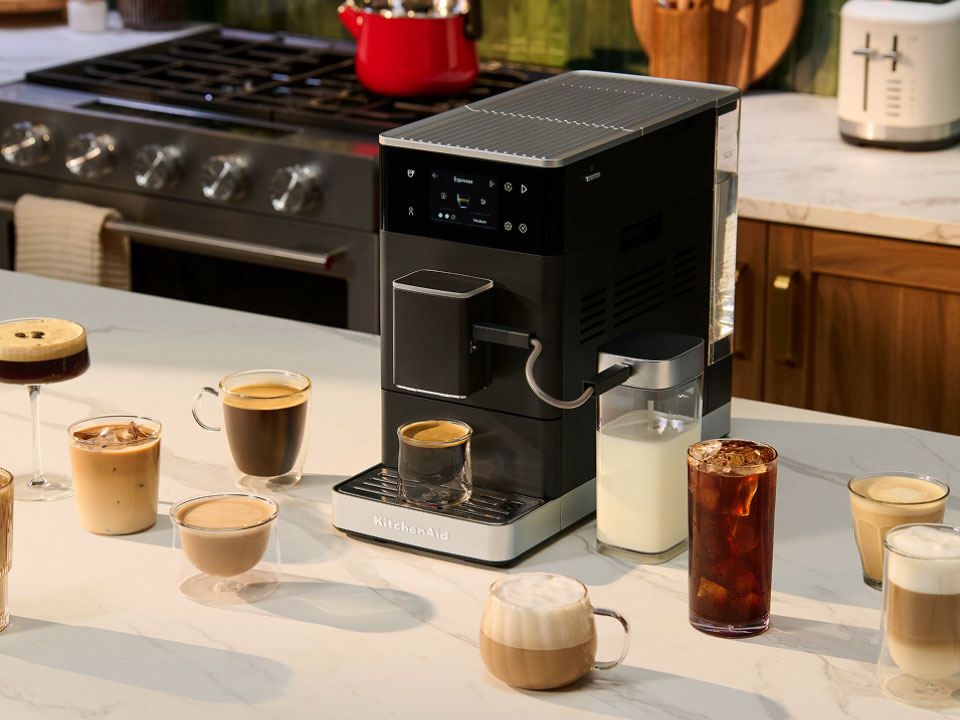 photo-left-right espresso-fully-auto-kf4 on-a-counter-surrounded-by-types-of-coffee