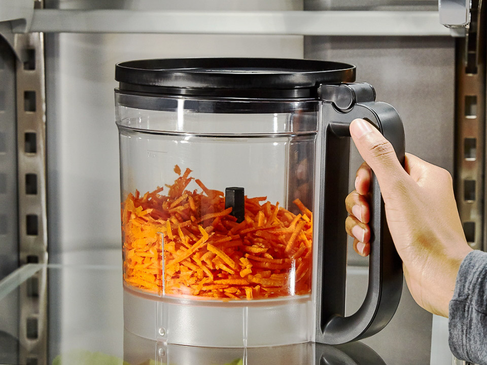 Food-processor-1319-plastic-work-bowl-used-to-store-cut-carrot