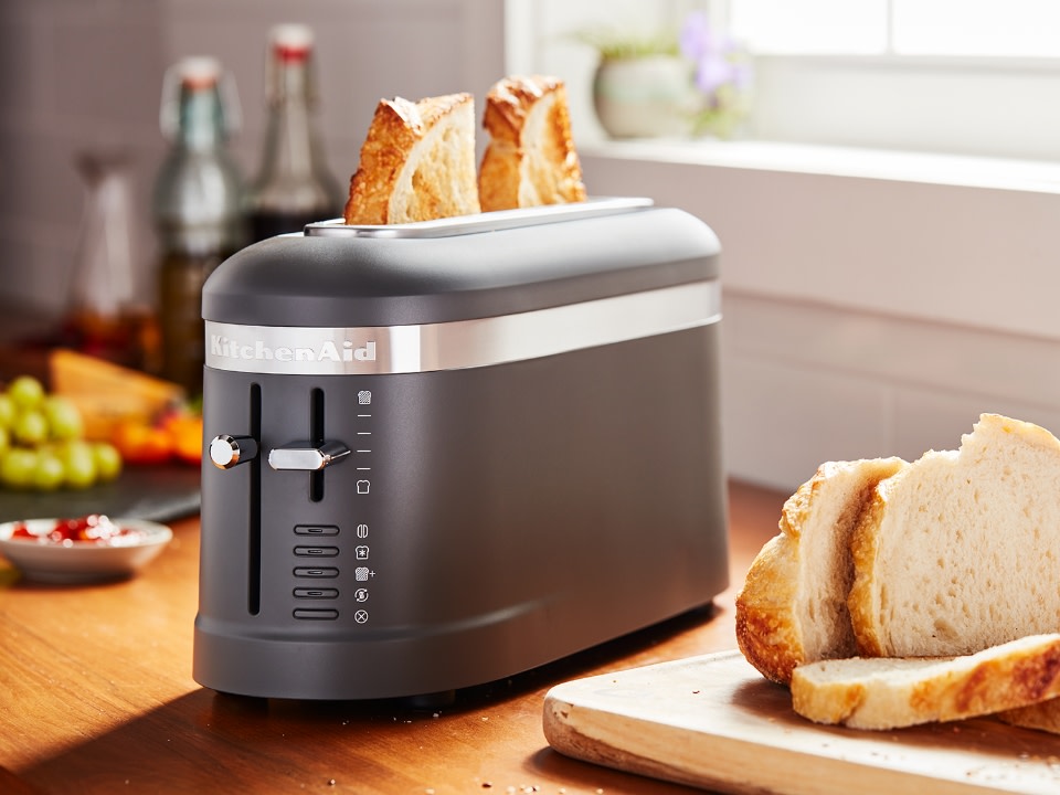 Breakfast-toaster-long-slot-2-slice-silver-toaster-toasting-in-the-kitchen
