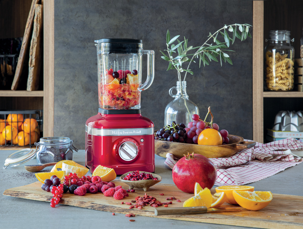 red-smoothie-blender-blending-fruits