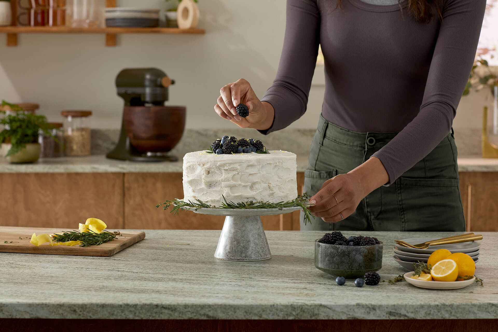 Lemon rosemary layer cake with dark berries