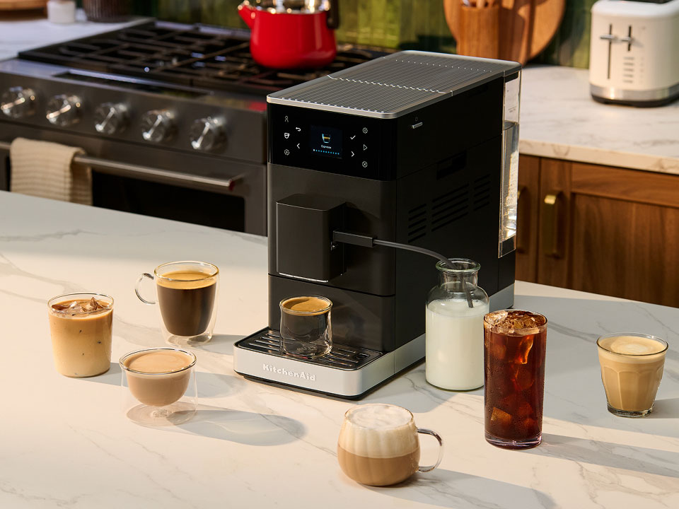 photo-left-right espresso-fully-auto-kf3 on-a-counter-surrounded-by-types-of-coffee