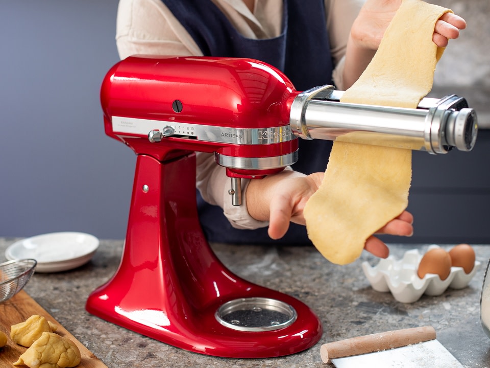 Mixer-attachments-pasta-roller-women-using-pasta-roller