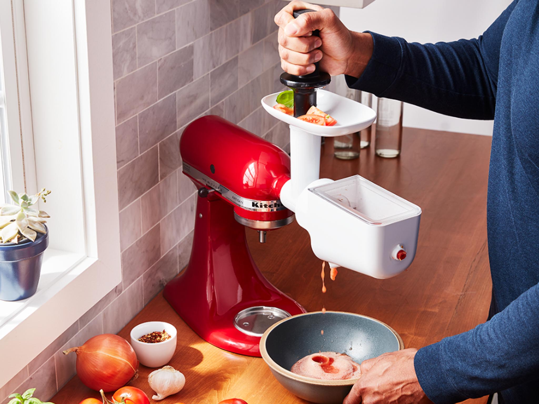 Mixer-attachments-food-strainer-extension-man-straining-the-tomato--juice