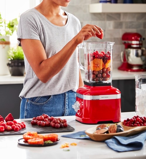 making-fruit-smoothie-with-red-blender