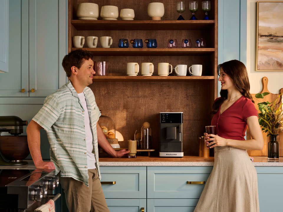 photo-left-right espresso-fully-auto-kf2 couple-enjoying-coffee-made-with-kf2-in-their-small-kitchen